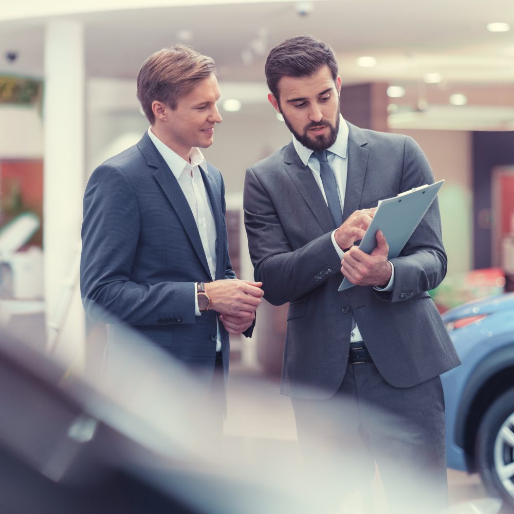 Manager and customer in showroom